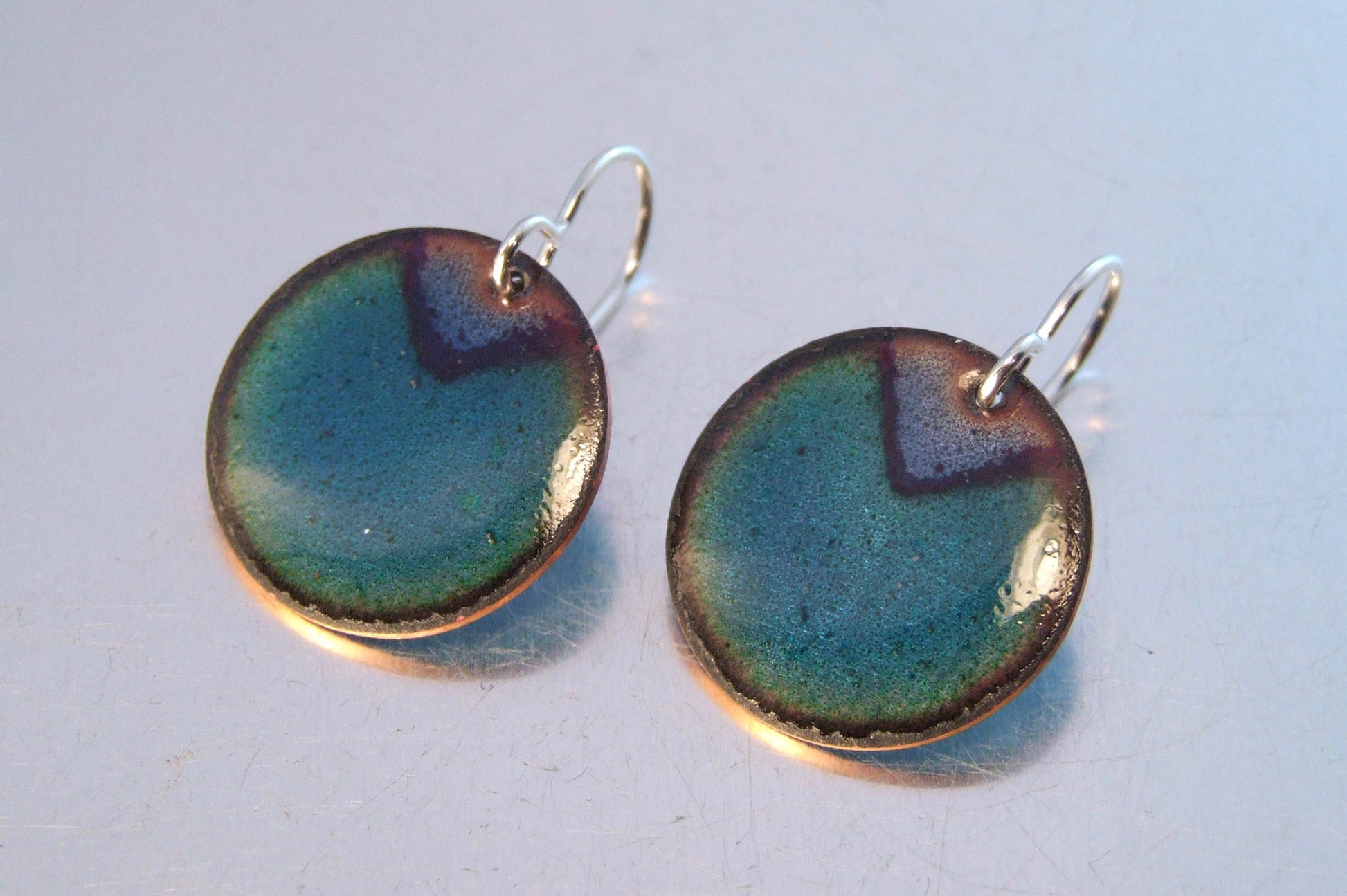 Round blue and green earrings