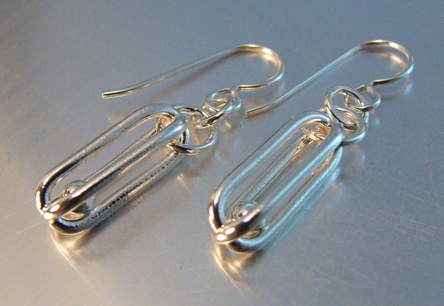 Silver dangle cage and ball earrings
