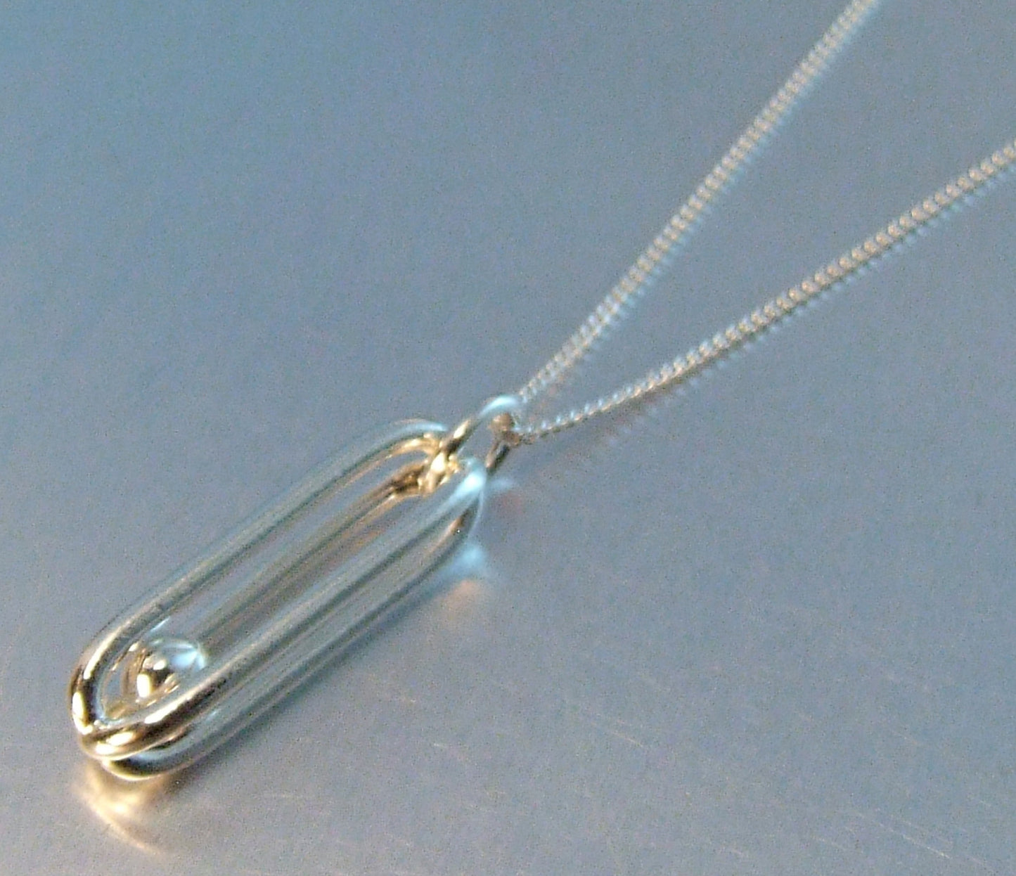 Silver cage necklace