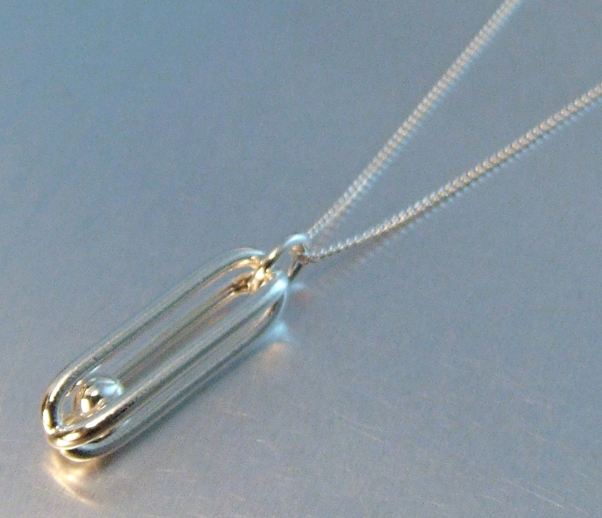 Silver cage necklace