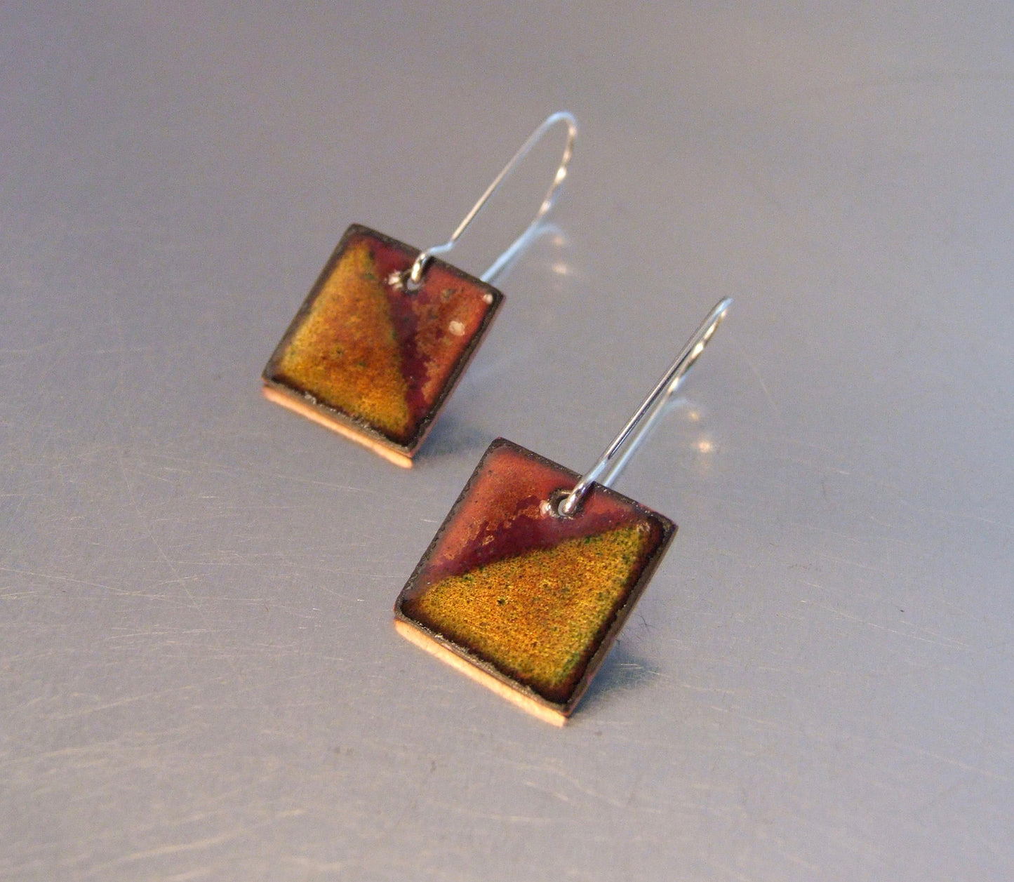 Square caramel coloured earrings: half and half