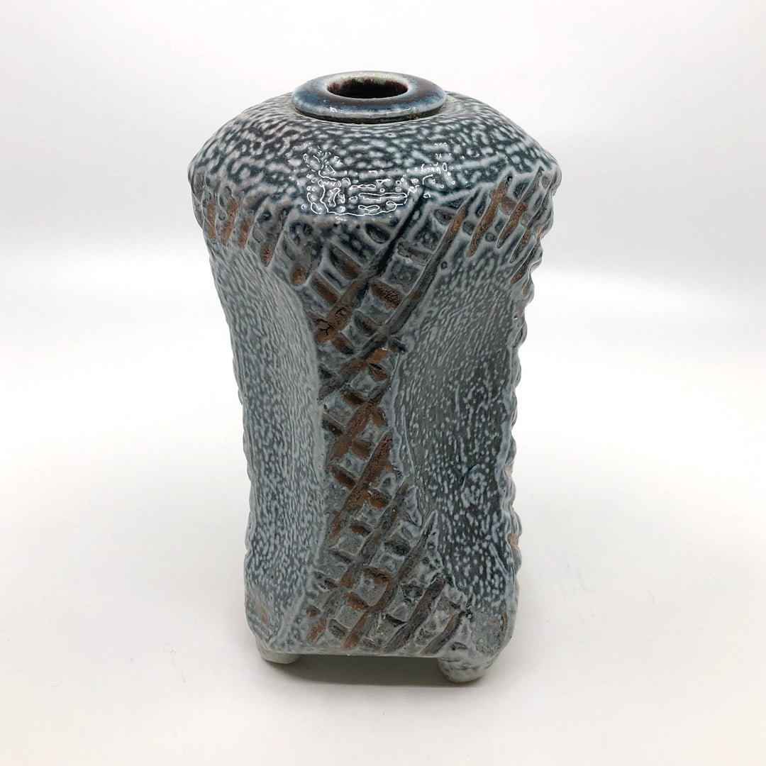 Incised and sculpted square vase