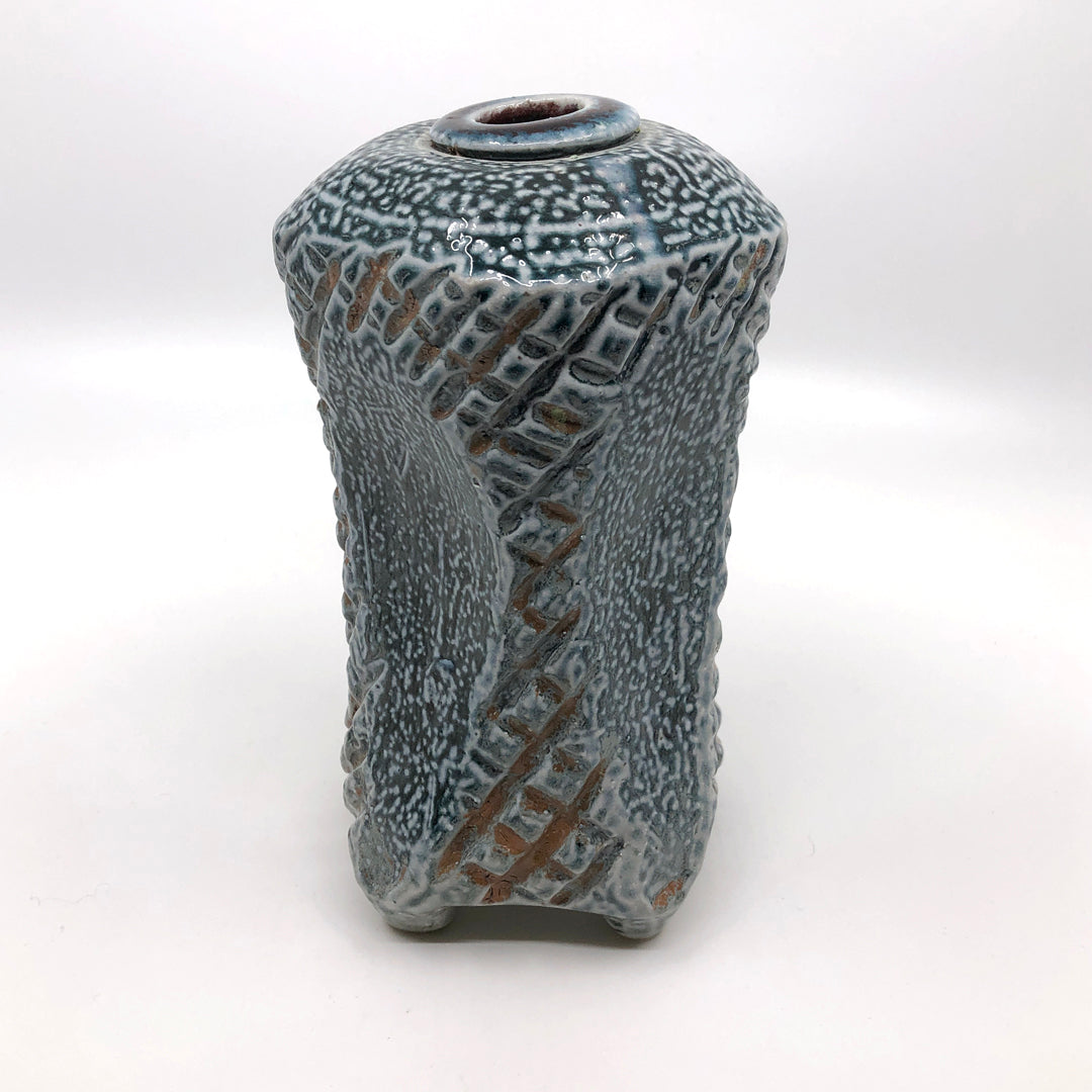 Incised and sculpted square vase