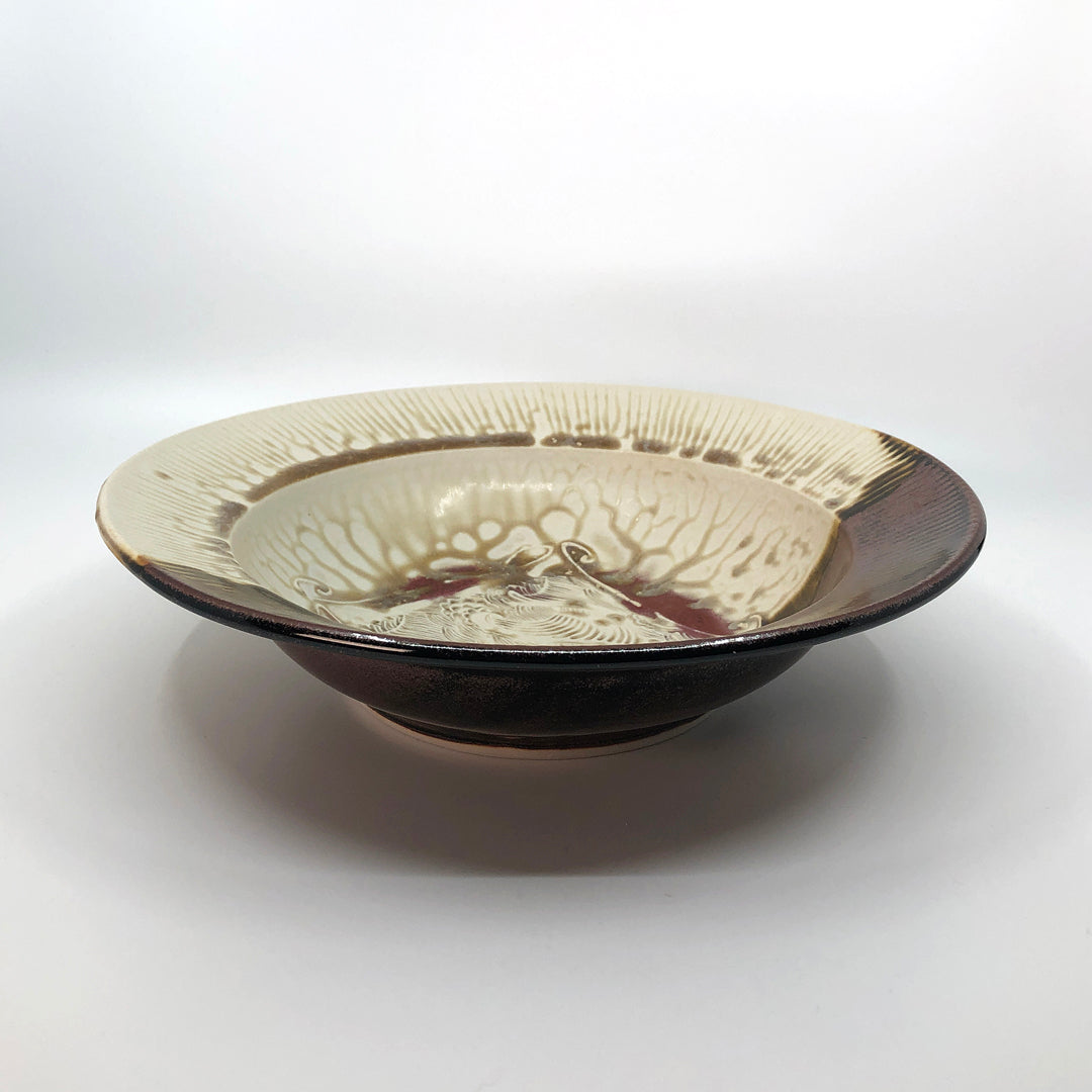 Large cream and brown bowl