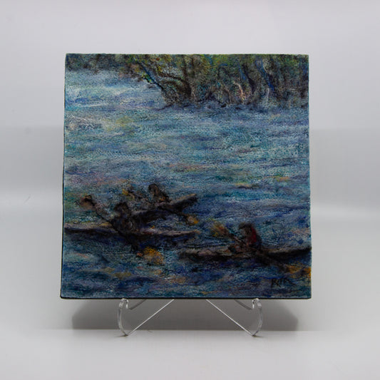 Felted painting of three kayakers in a river