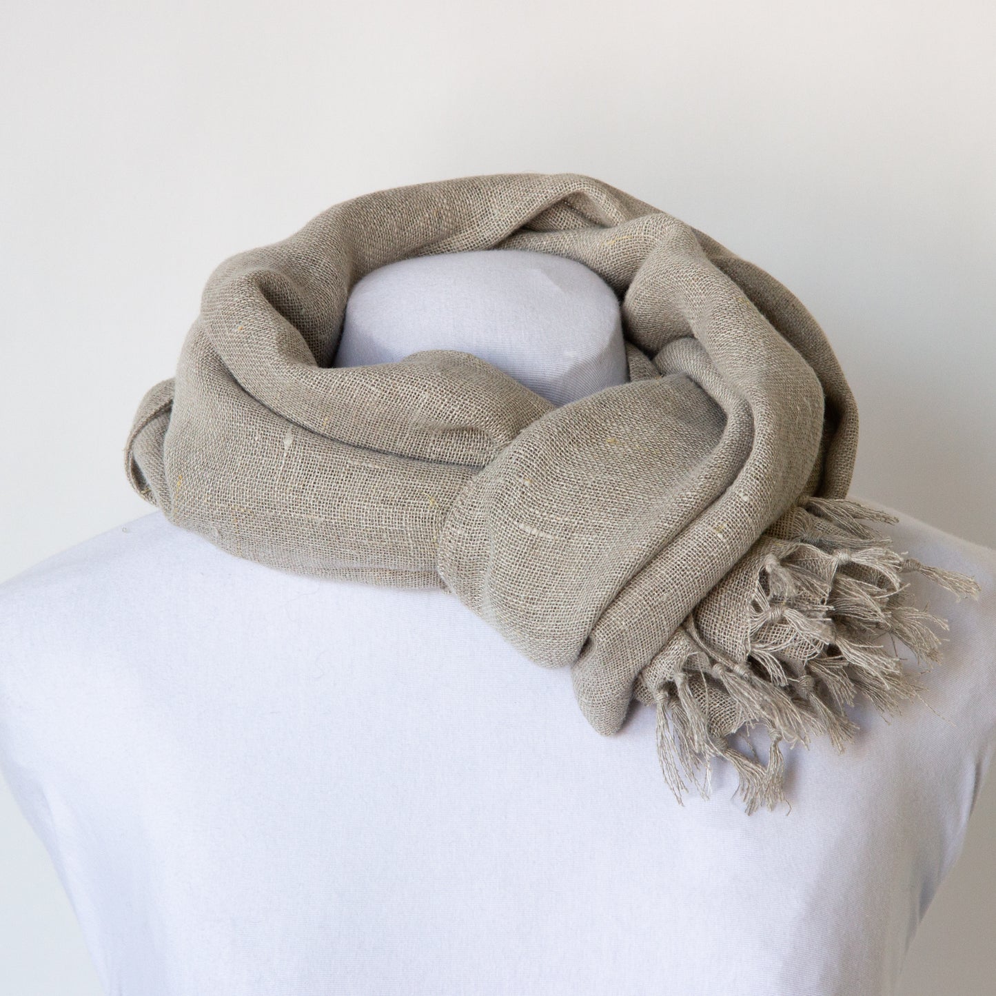 Neutral coloured linen scarf: tied