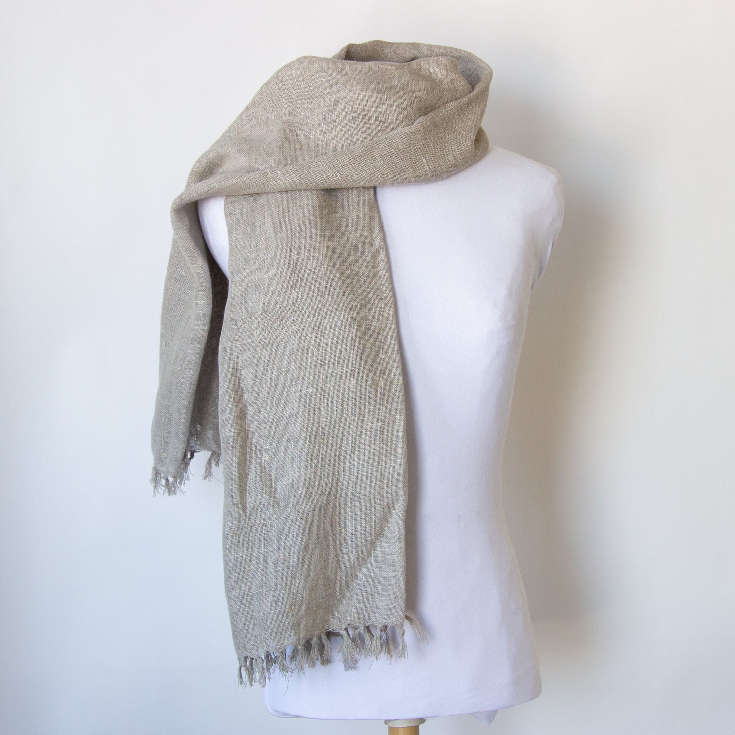 Neutral coloured linen scarf: over the shoulder