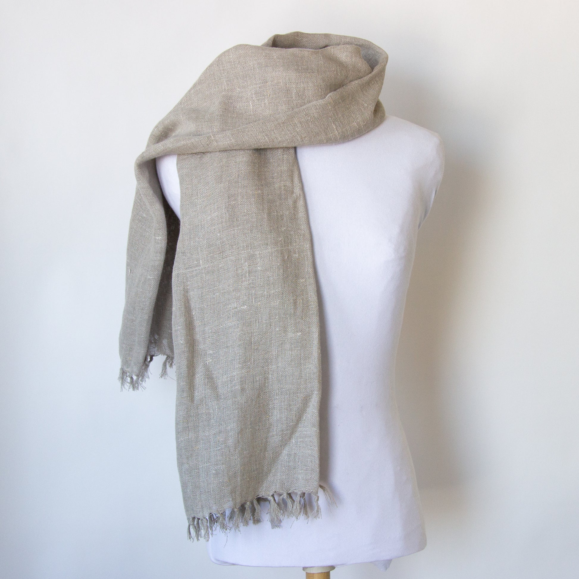 Neutral coloured linen scarf: over the shoulder