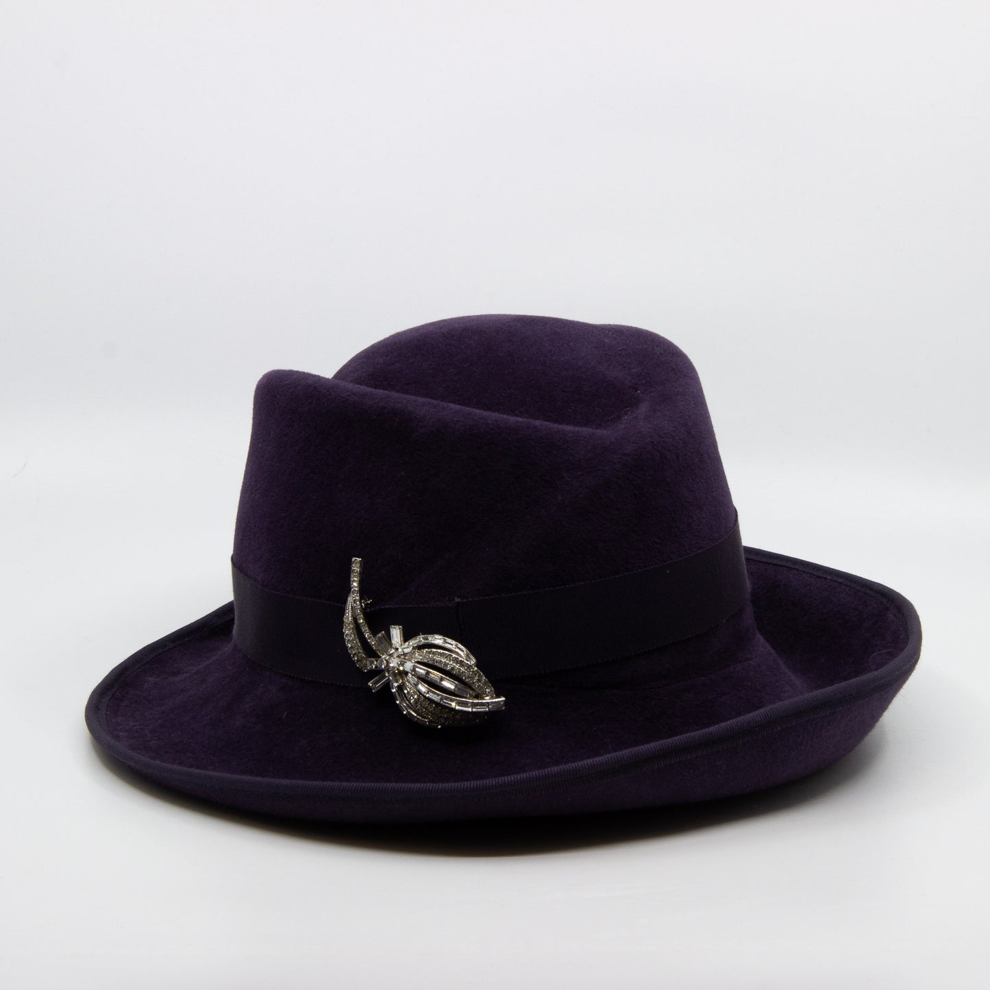 Purple fedora hat with silver pin