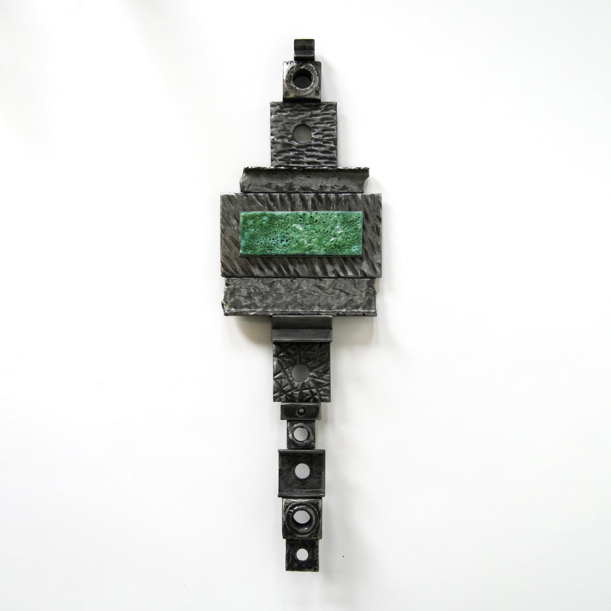 Metal wall hanging with green accent