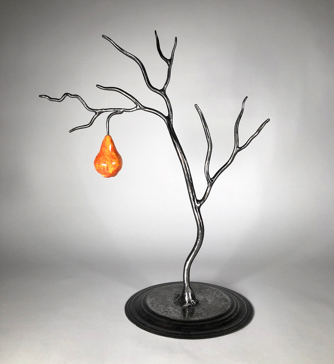 Small metal tree with orange pear