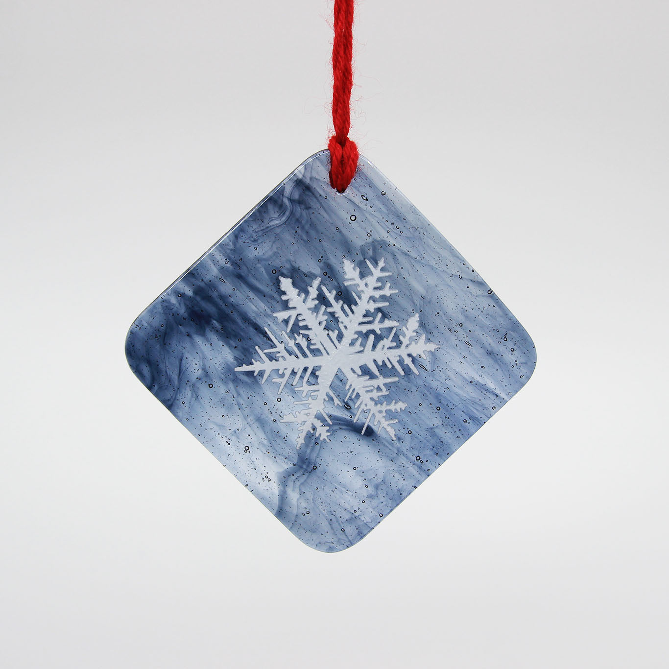 Grey and white diamond glass ornament with snowflake