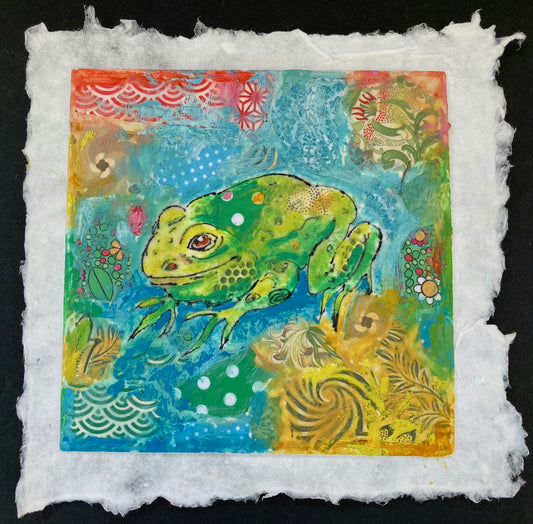 Colorful artwork of a frog on textured paper with floral elements