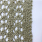 Close-up of a textured fabric pattern on a white background