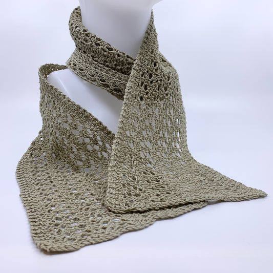 Knitted scarf on a mannequin against a white background