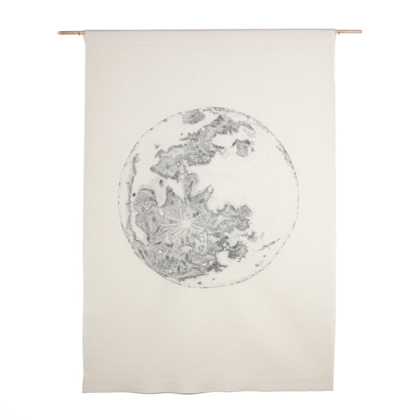 A large white wall hanging, featuring a grey embroidered image of the full moon.