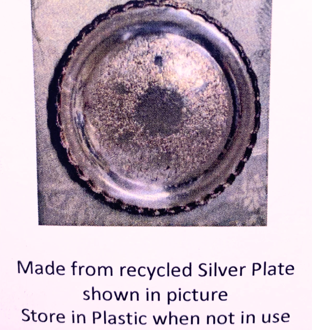 A square product photo of a tarnished silver plate with a scalloped rim, shown above text that reads 'Made from recycled Silver Plate shown in picture Store in Plastic when not in use'.