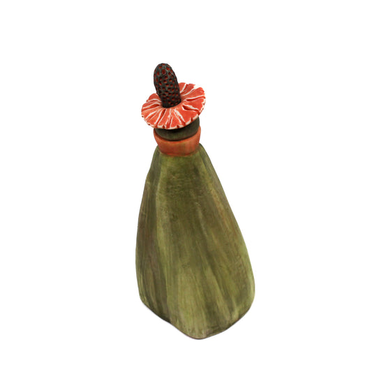 Green pod bottle with pink flower neck and stopper