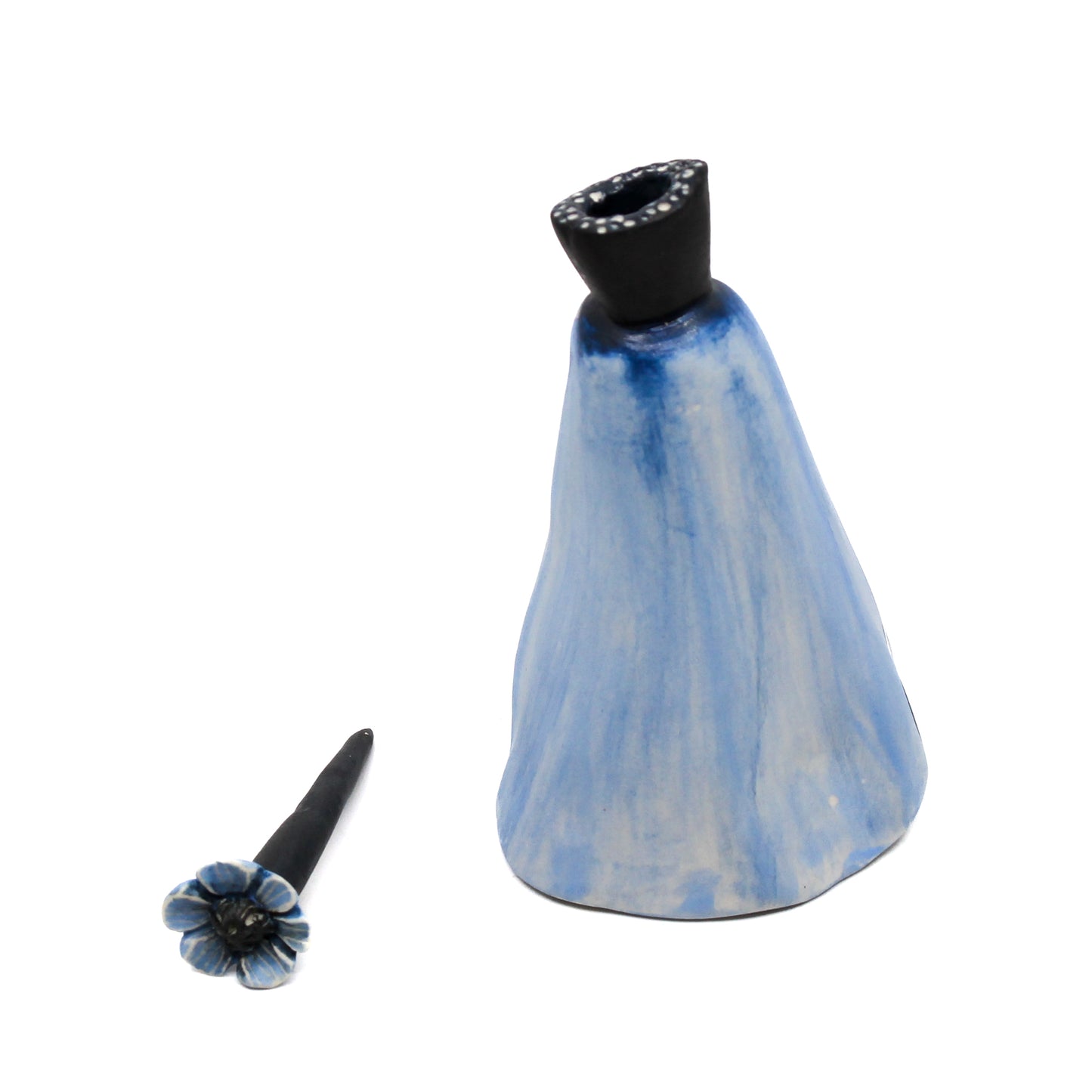 Blue pod bottle with blue flower stem stopper