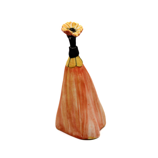 Orange pod bottle with yellow flower stem stopper