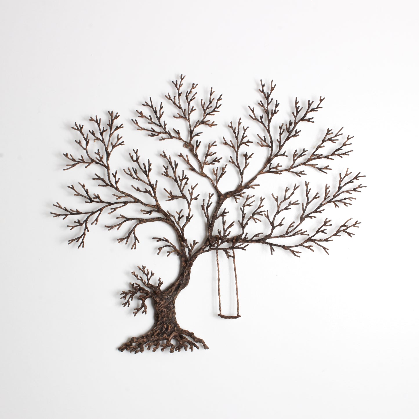 metal work tree with swing
