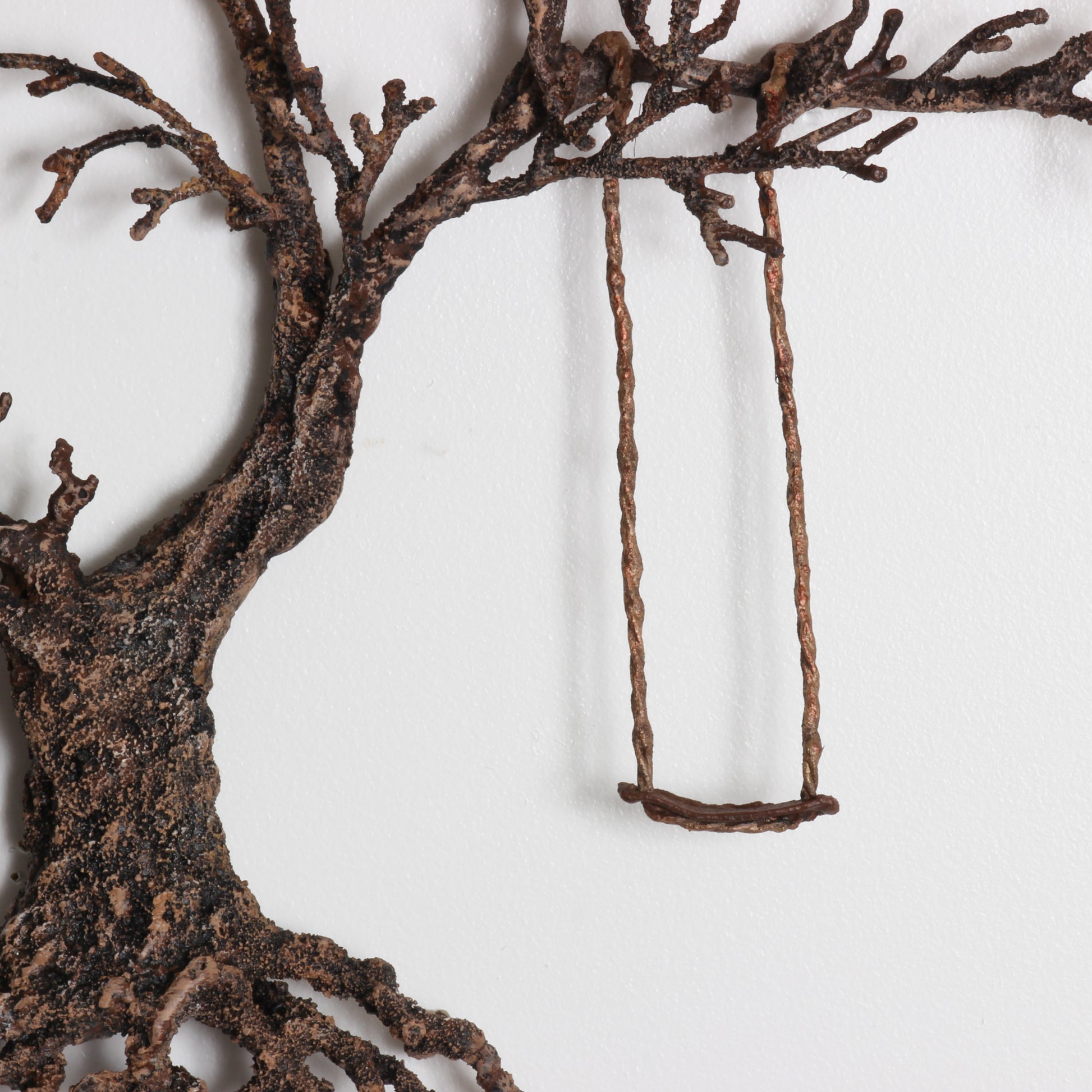 metal work tree with swing