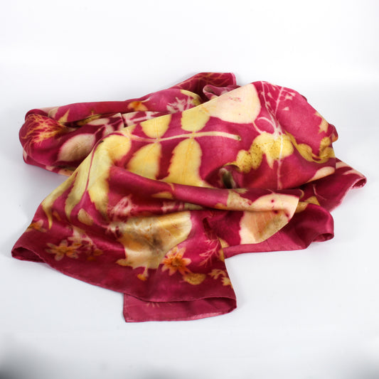 Folded fabric with red and yellow pattern on a white background