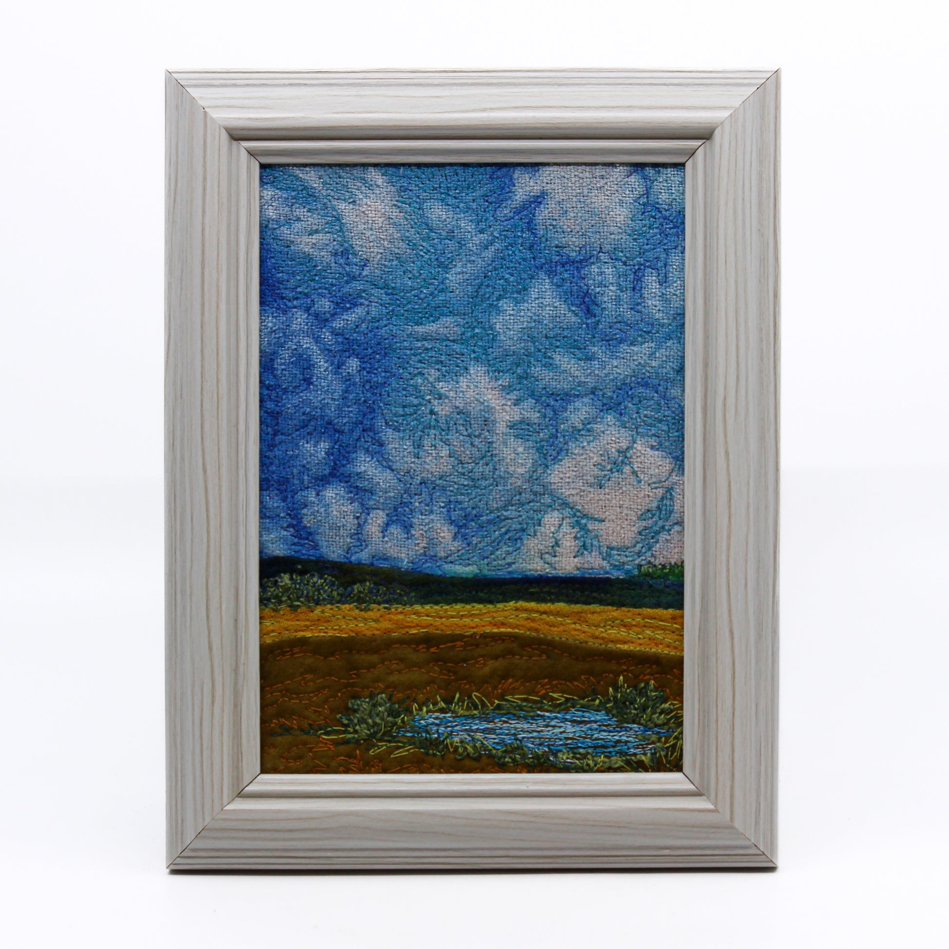 Thread painting of prairie slough