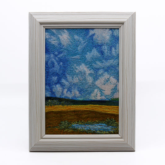 Thread painting of prairie slough