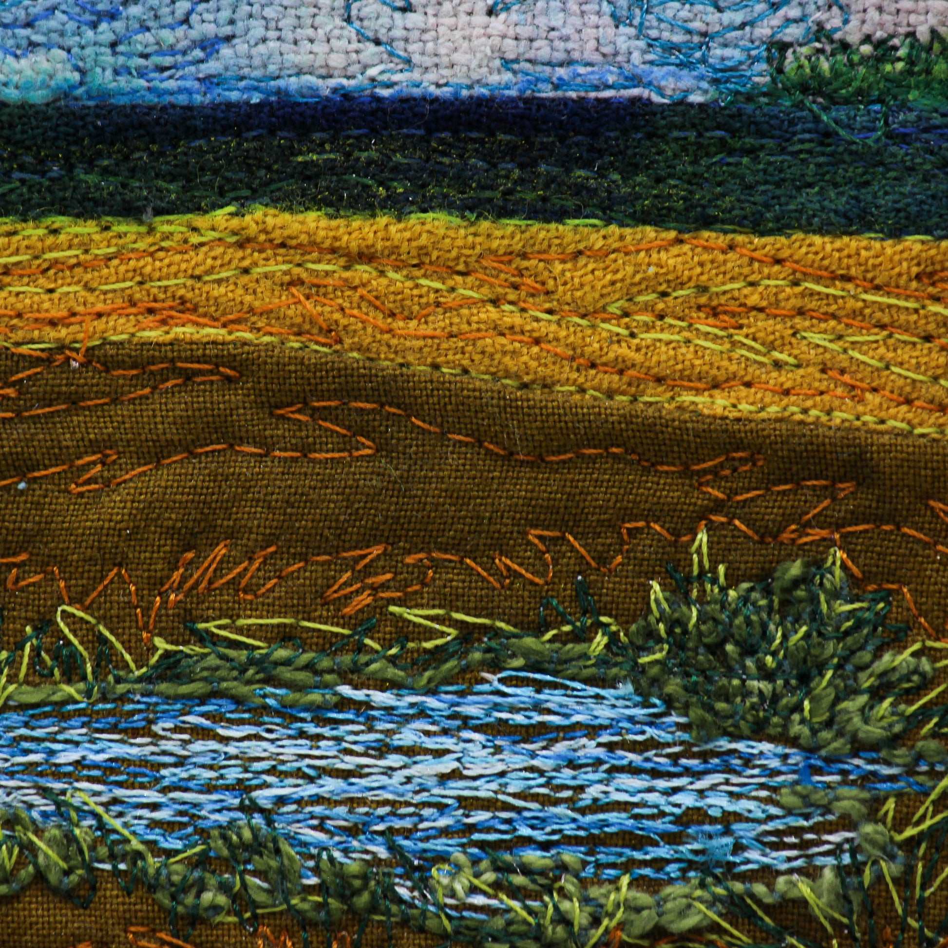 Close up of thread painting prairie slough