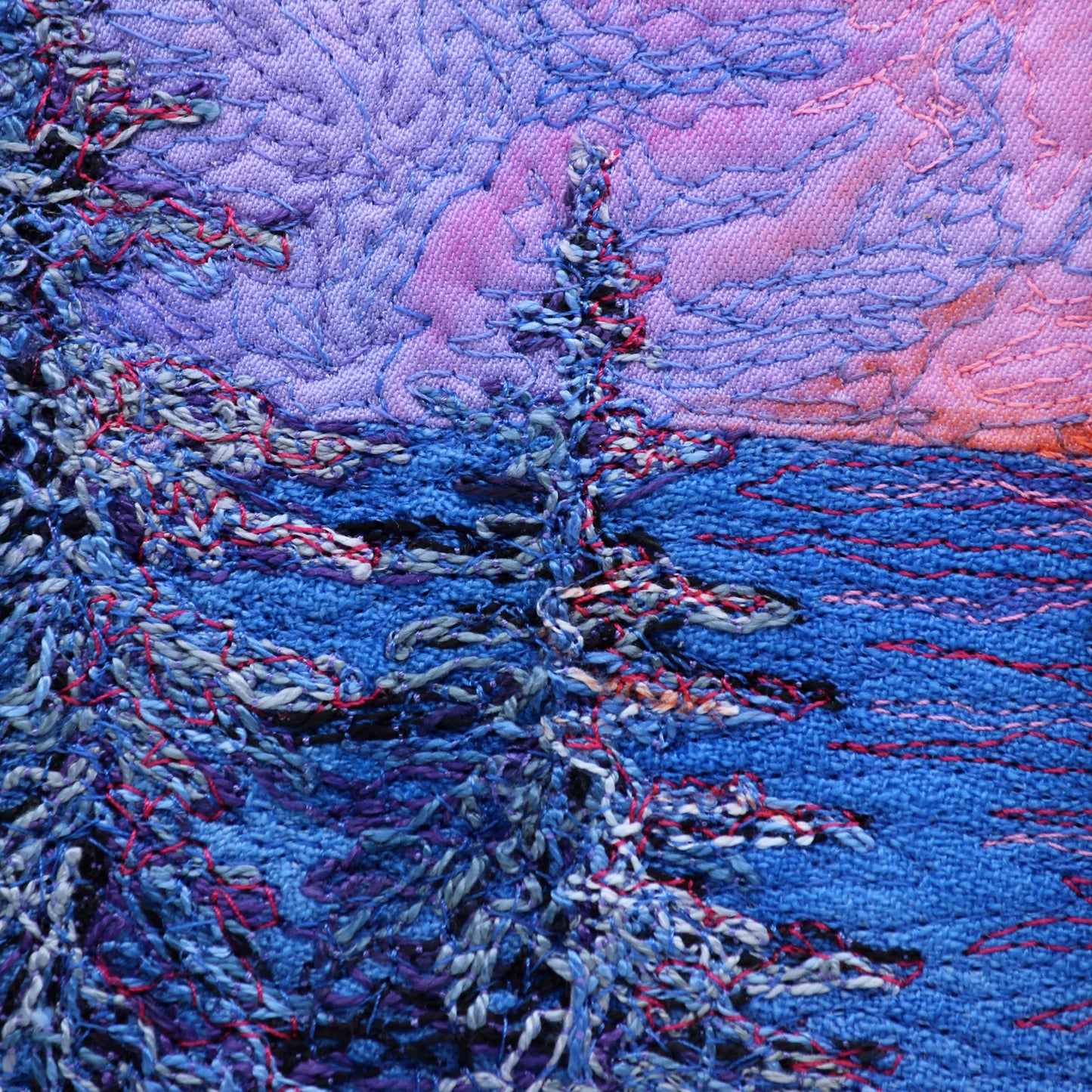 close up of thread painting sunset 