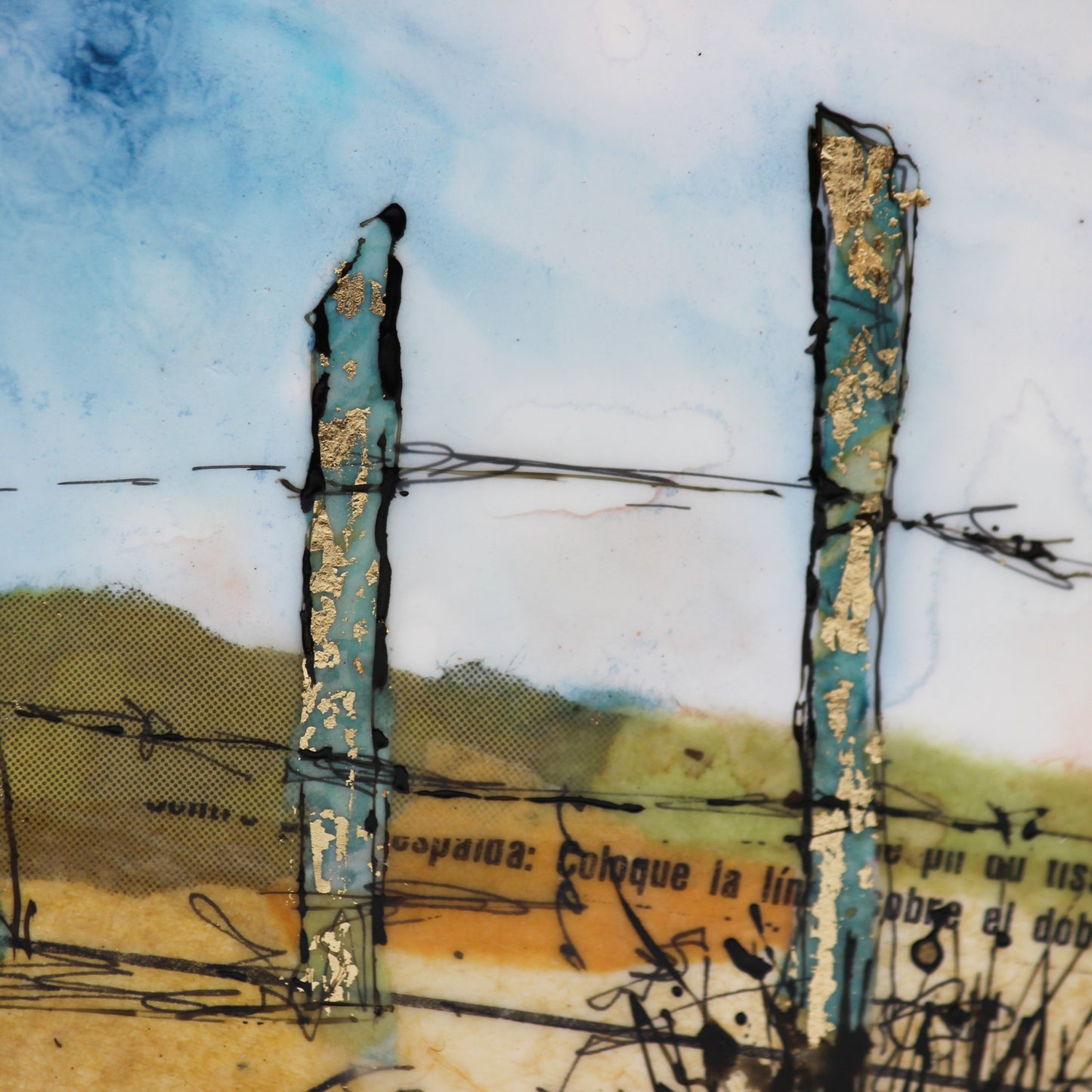 Close up encaustic collage fence line with gold leaf 