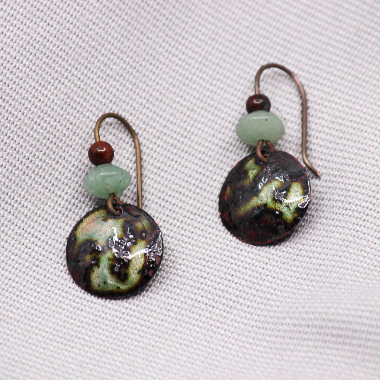 green and black earrings