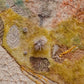 Textile art piece with natural patterns and textures