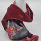 Red velvet scarf with an abstract pattern on a white background
