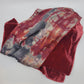 Red velvet scarf with an abstract pattern on a white background