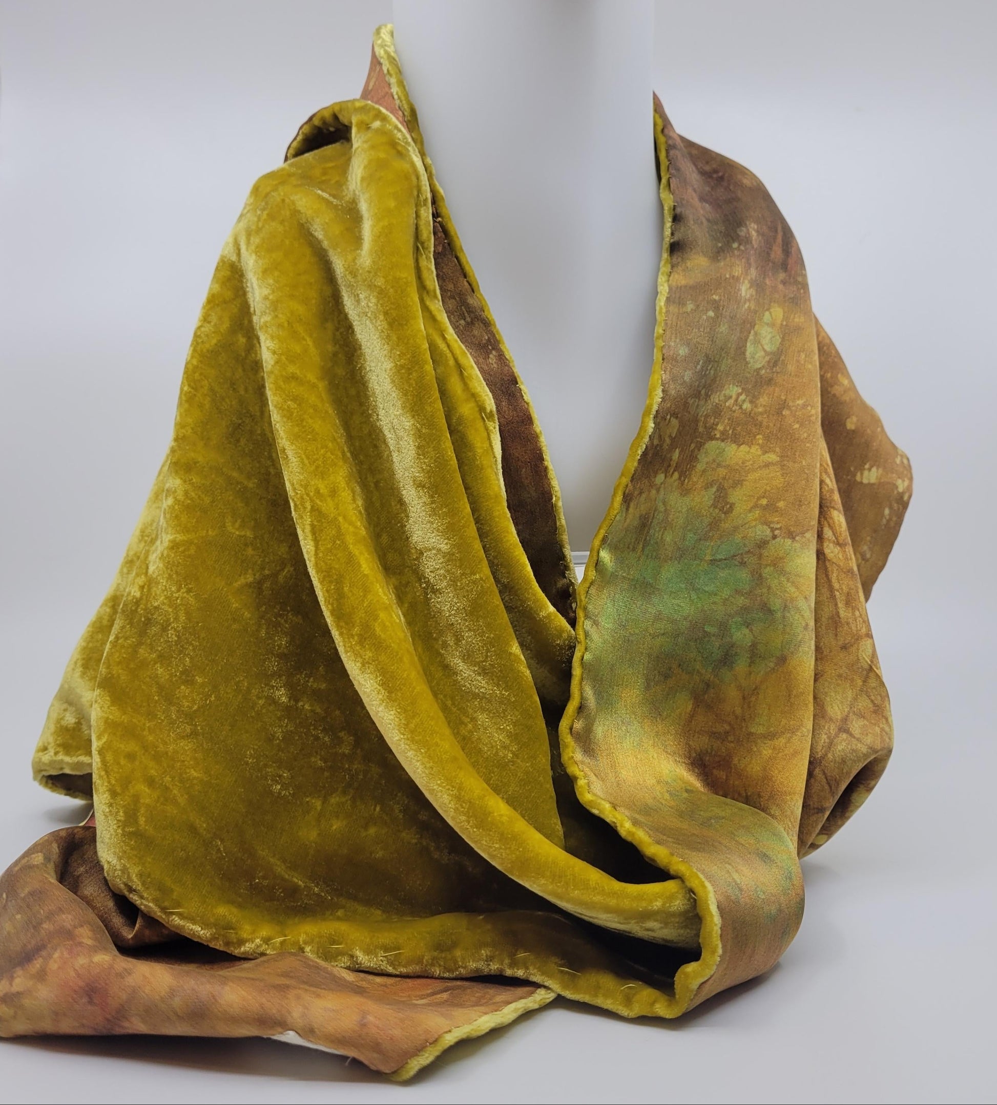 Lime green/yellow velvet scarf on a white background