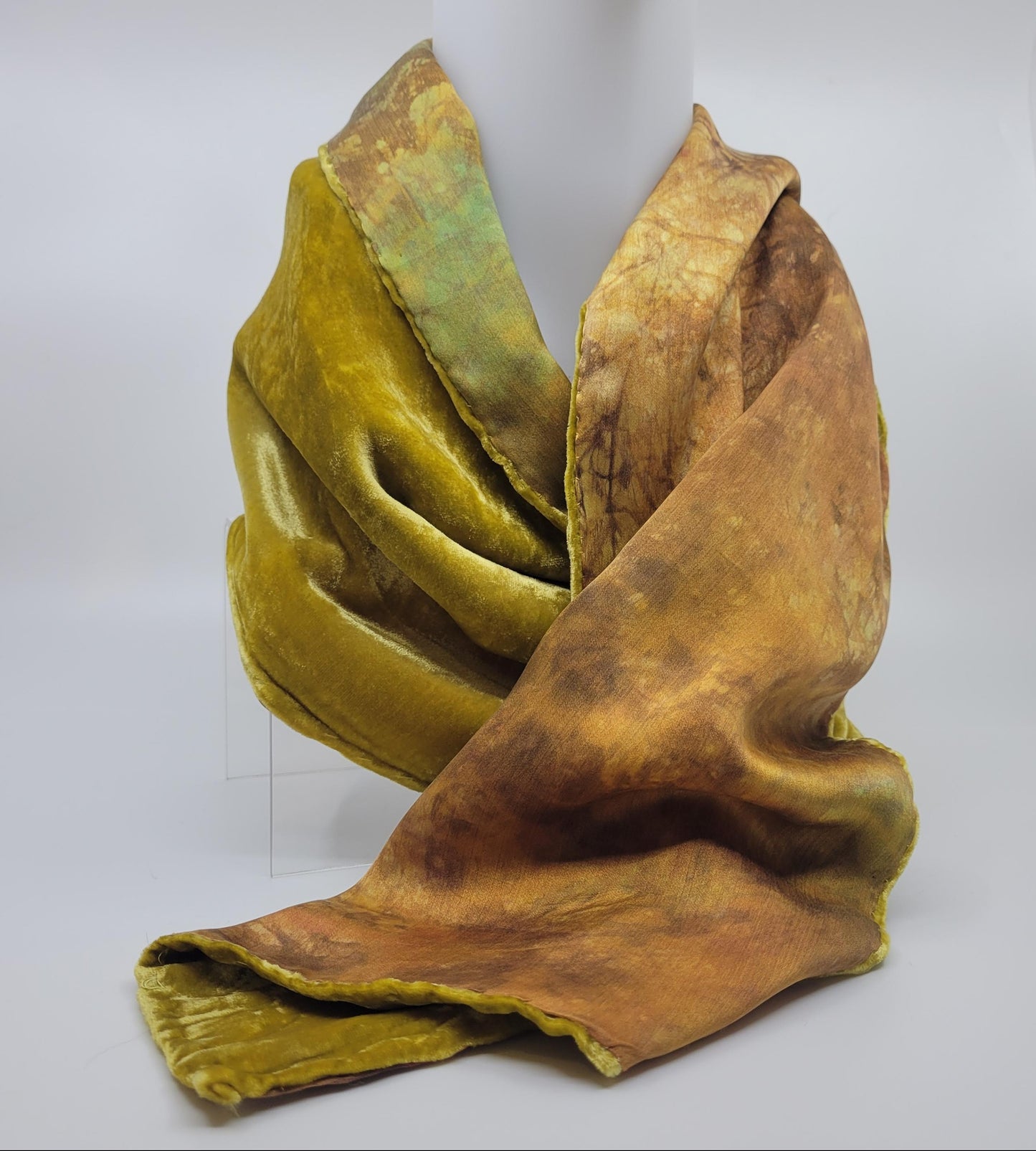 Lime green/yellow velvet scarf on a white background