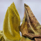 Lime green/yellow velvet scarf on a white background