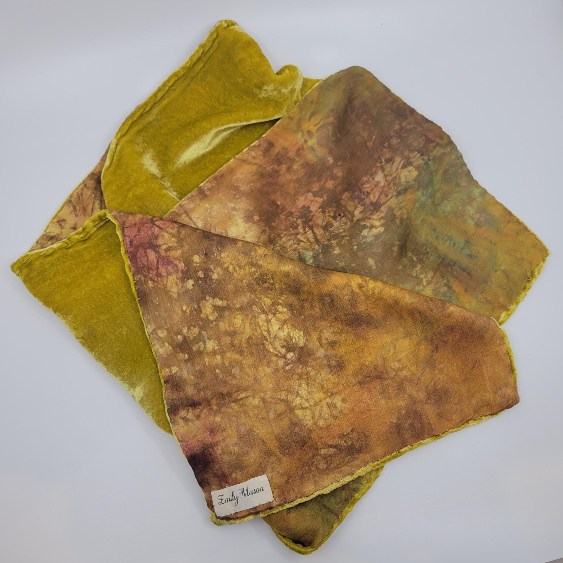 Lime green/yellow/brown velvet scarf on a white background