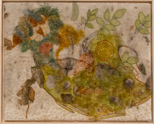 Textile art piece with floral patterns and natural elements on a textured background