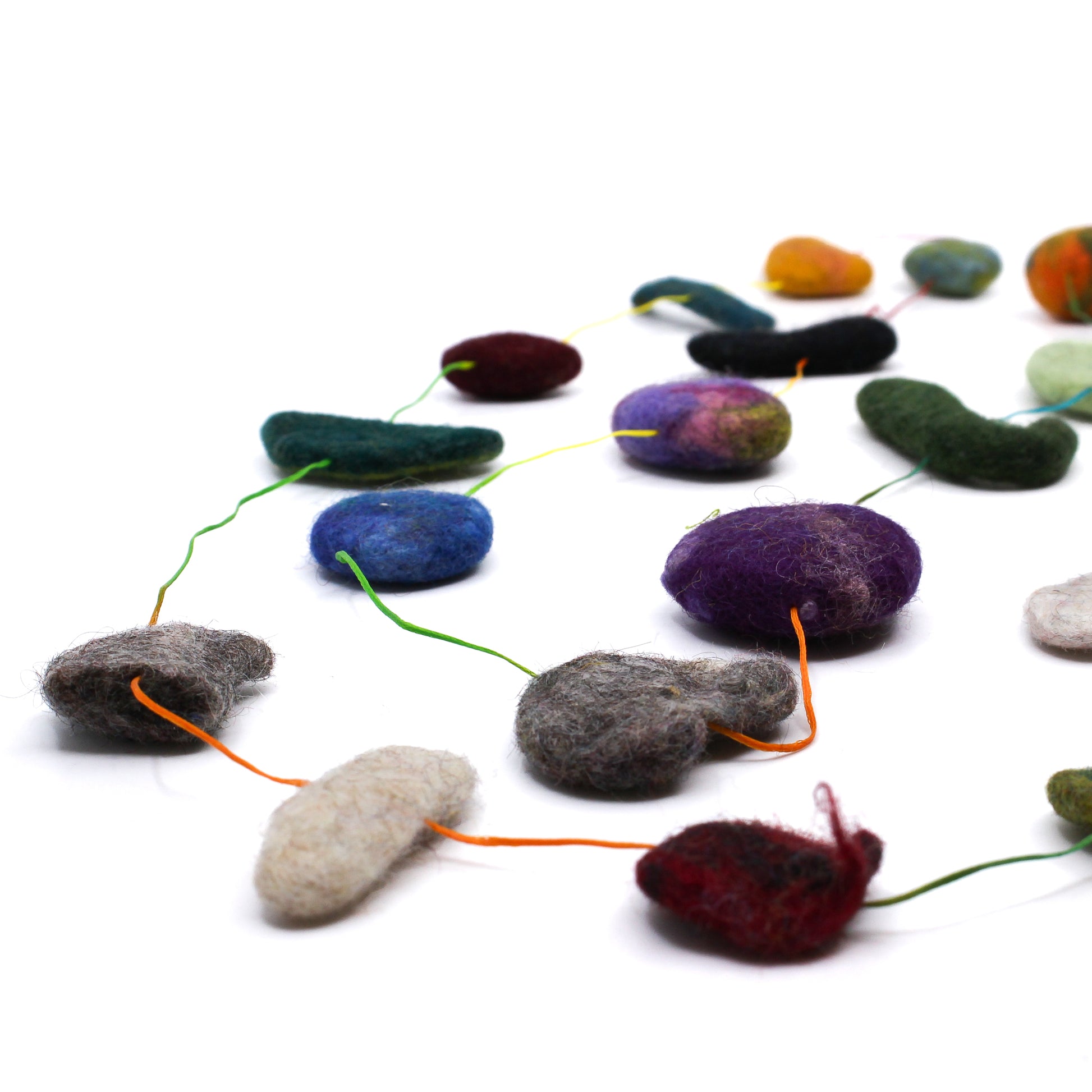 Colourful felted beads on colourful string