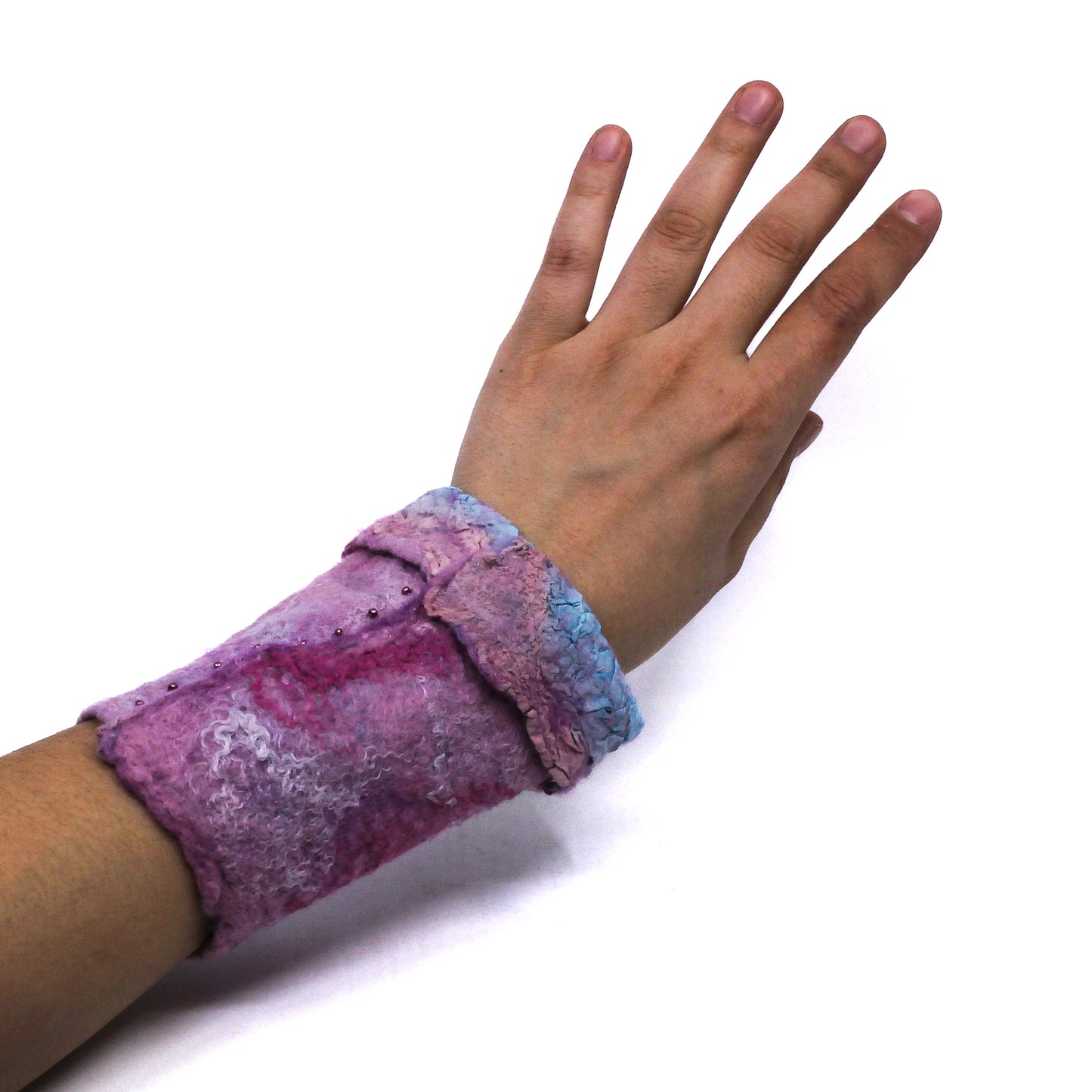 An arm wearing pink wrist wamer