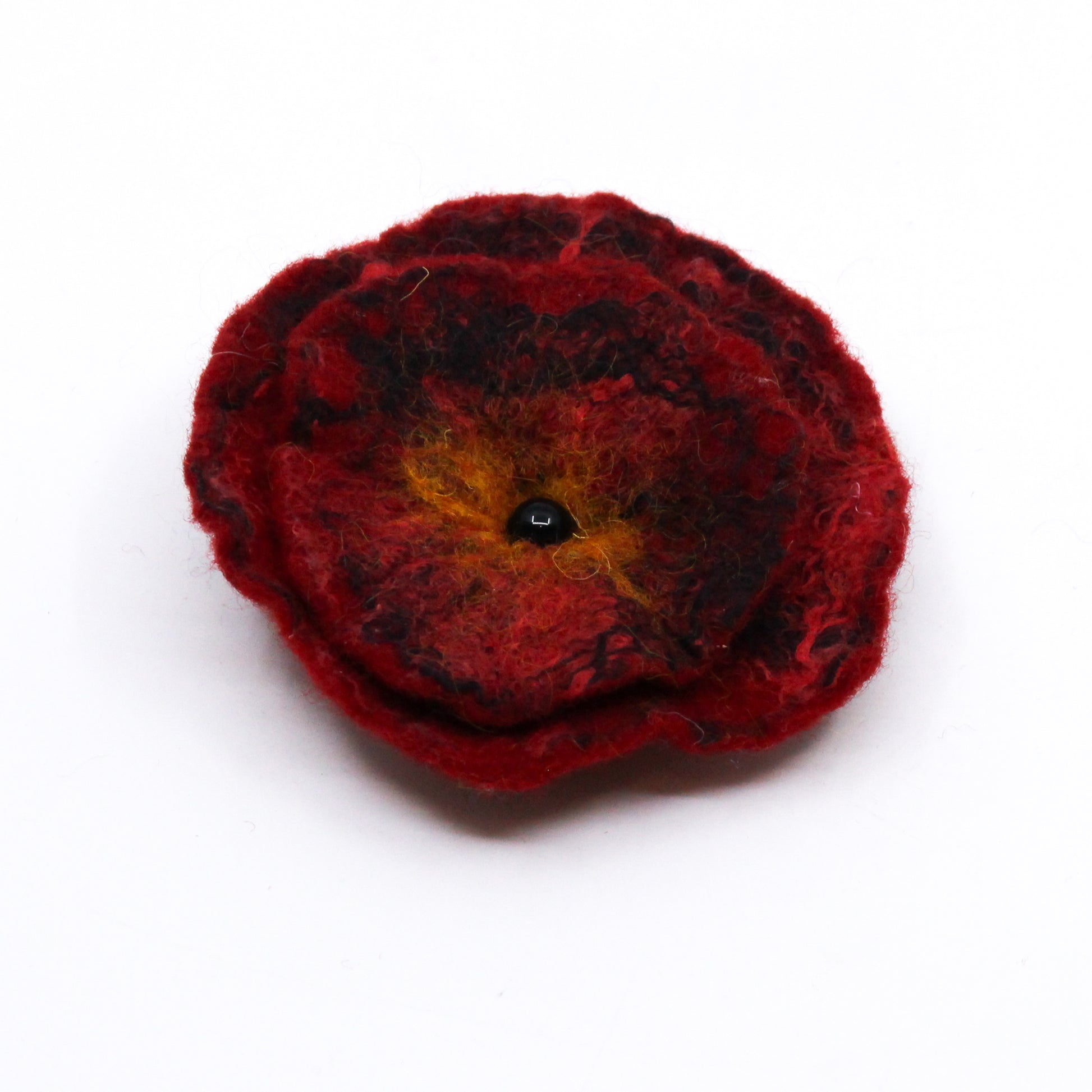 Felted poppy with black bead