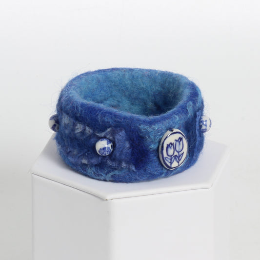 Blue felted bracelet with white and blue beads 
