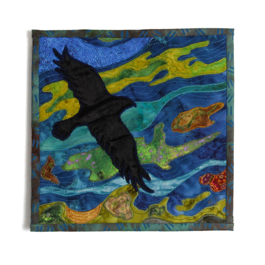 mini quilt of raven over lake 