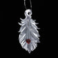 translucent feather with red heart ornament 