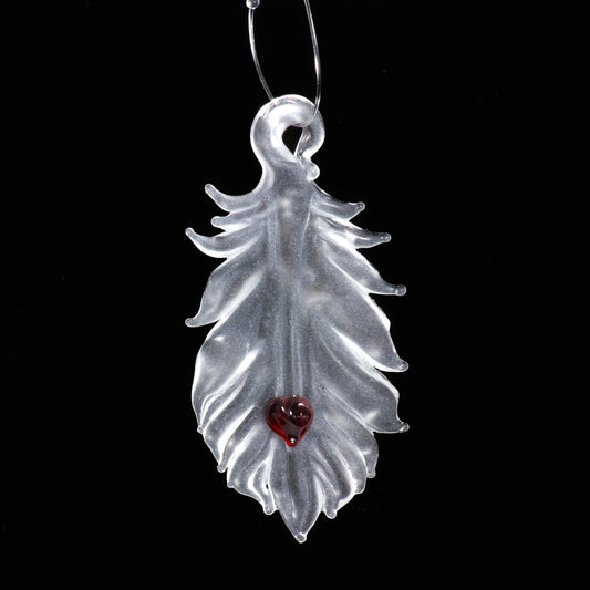 translucent feather with red heart ornament 