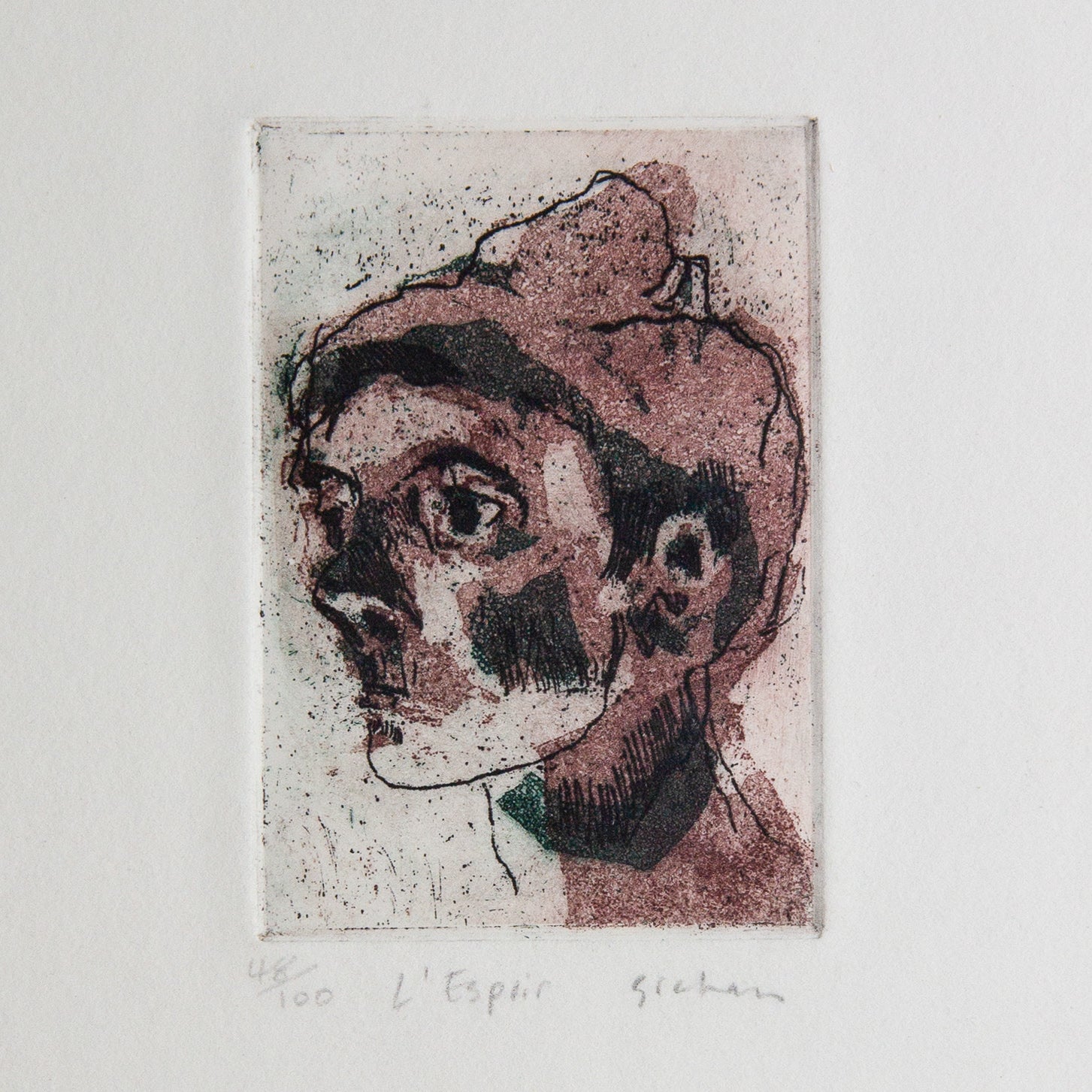 etching of a profile face in red and black