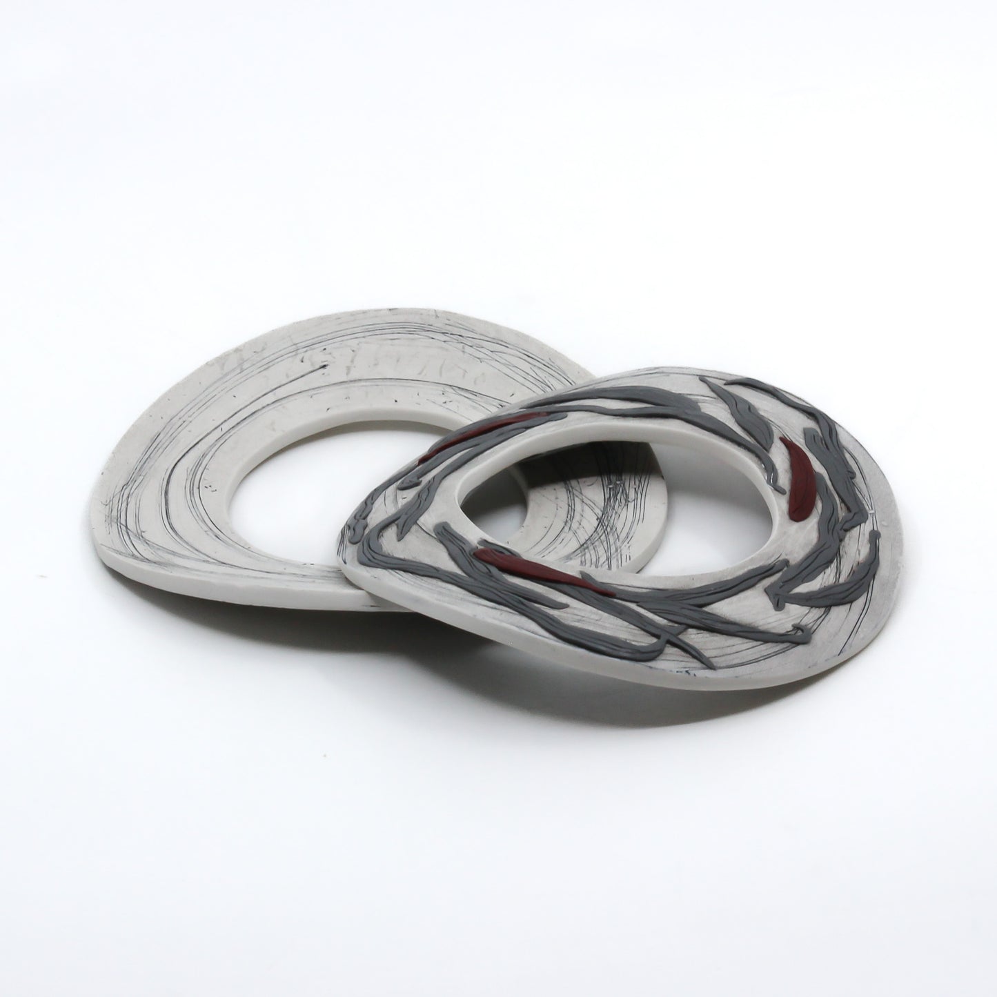 White polymer clay cuffs with grey and red accents